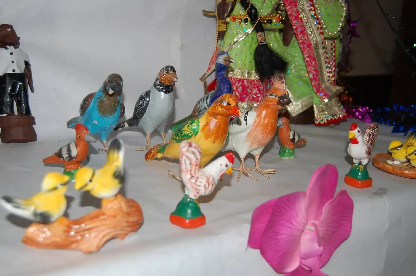 Birds in a Golu display over Hindu Navaratri festival Kolu dolls