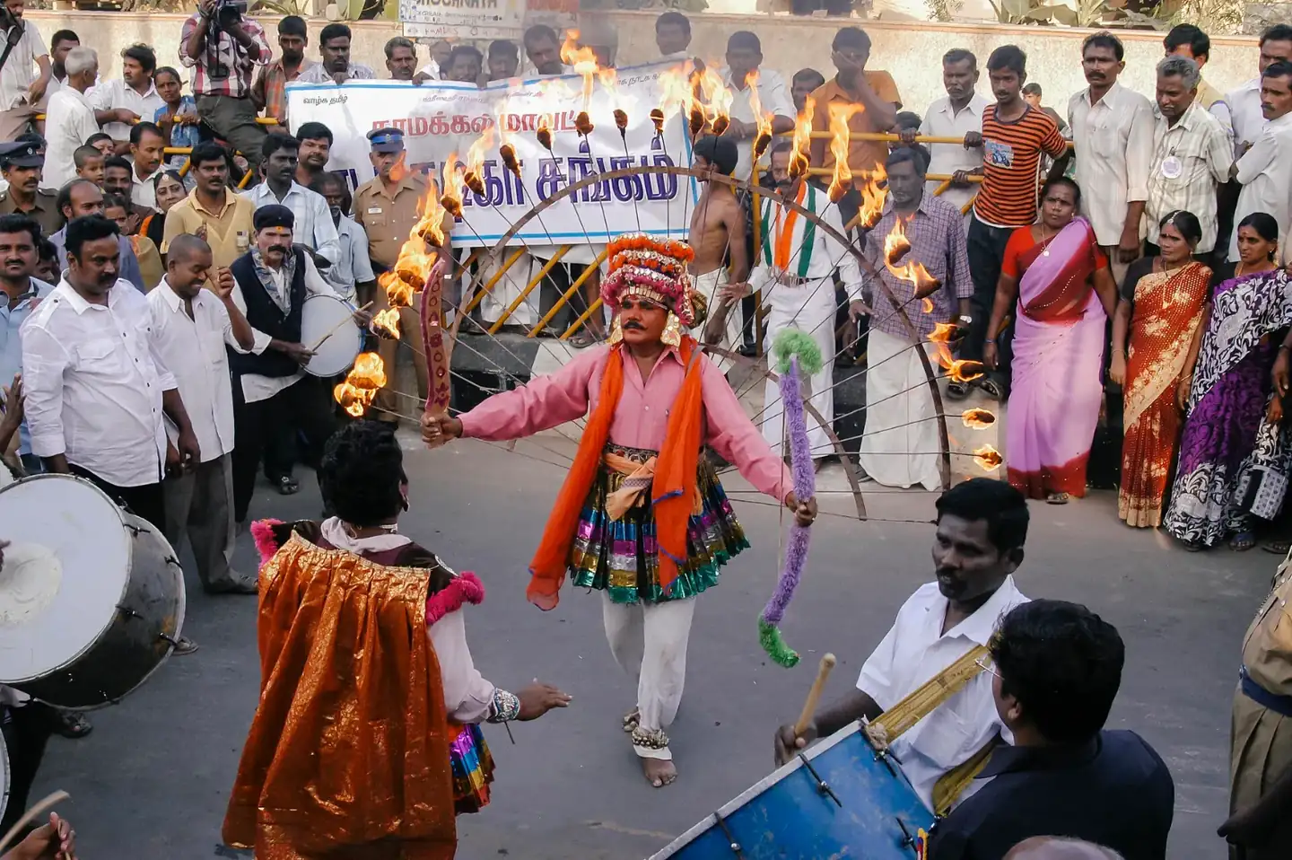 A man dancing with fire at a Pongal Festival in Namakkal, Tamil Nadu, India